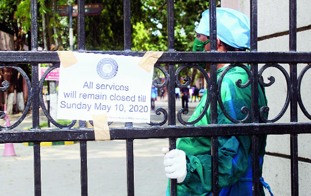 The closure sign pasted at the entrance to B. Borooah Cancer Institute in Guwahati on Friday. 