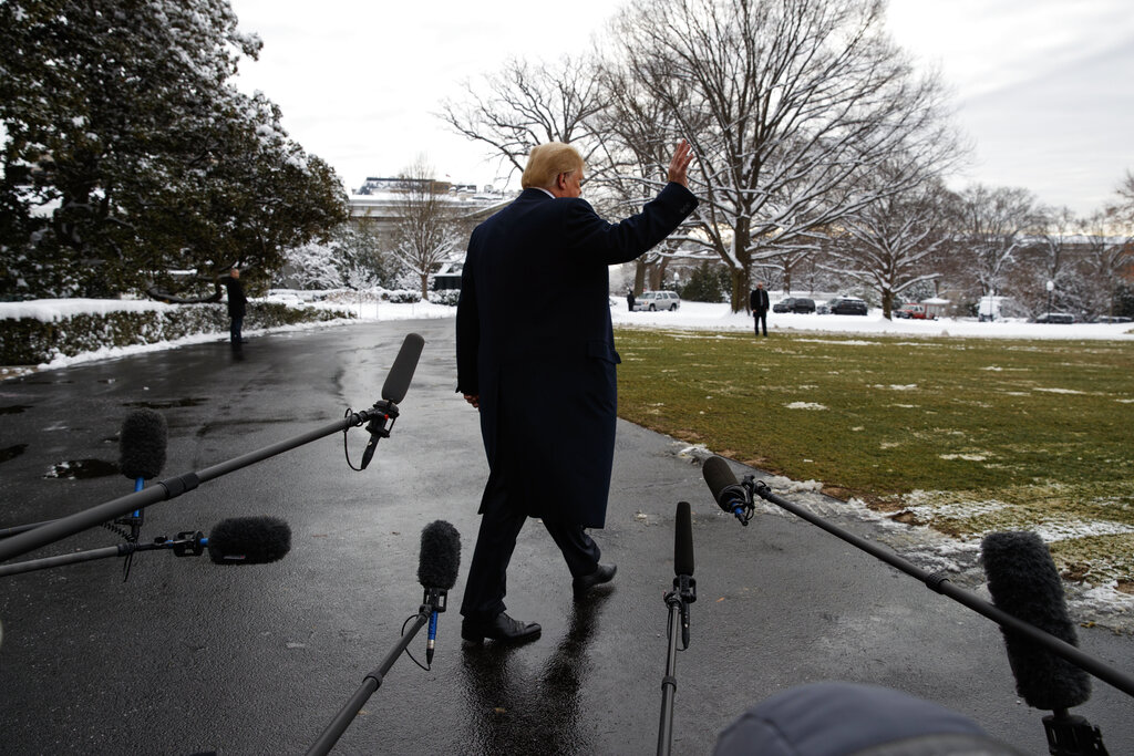 Donald Trump walks off after speaking with reporters on the South Lawn of the White House on Monday, Jan. 14, 2019.