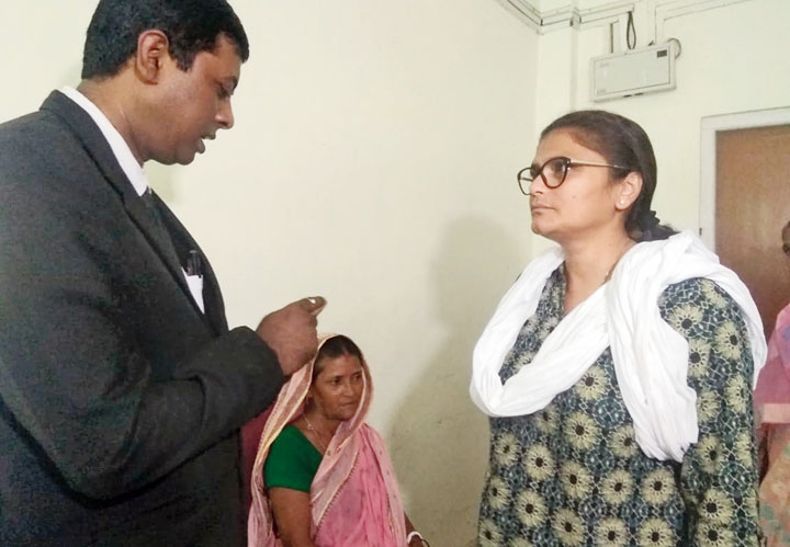 Sushmita Dev interacts with an official at a foreigners tribunal in Silchar
