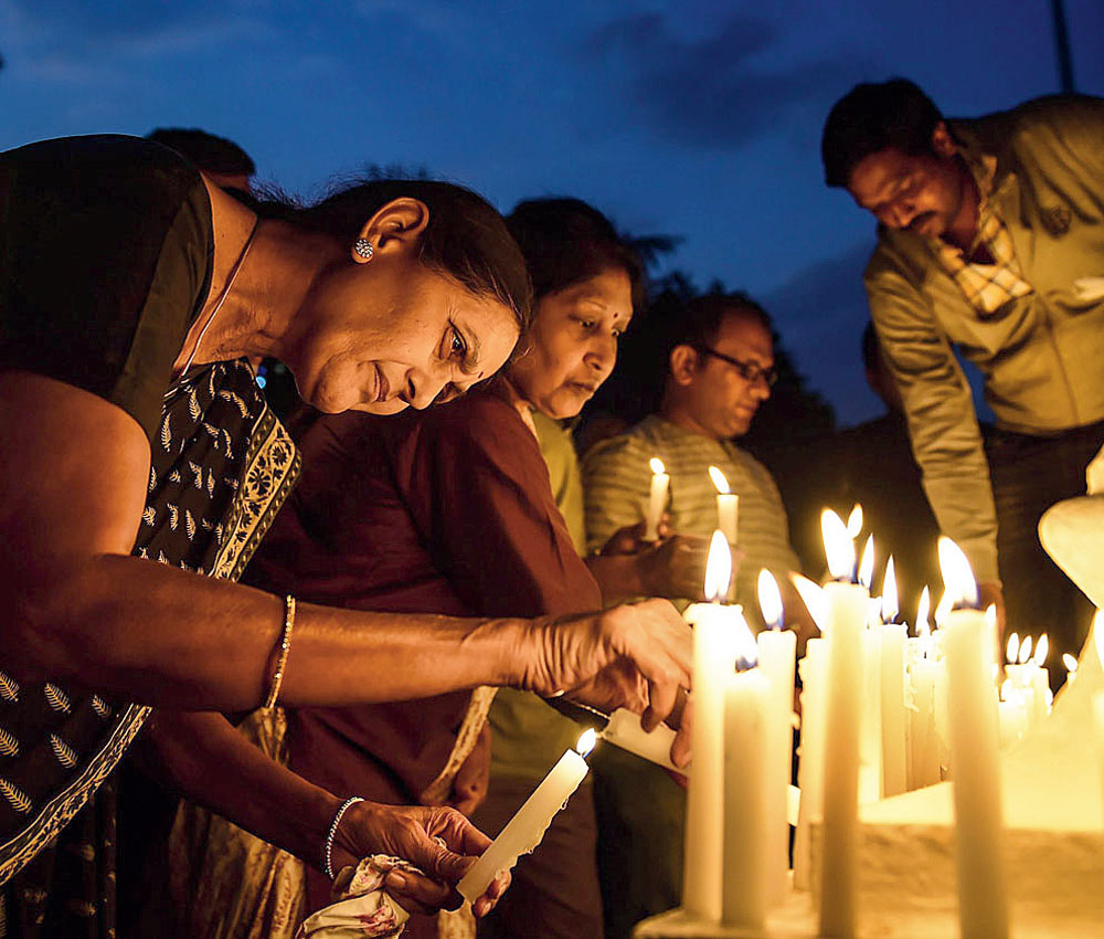 Citizens offer tribute to the Central Reserve Police Force soldiers killed in the Pulwama terror attack by lighting candles in Bangalore on Saturday, February 16.