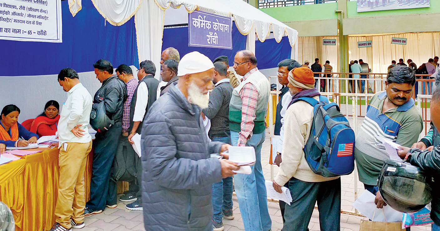 Government employees, who will double up as polling officials during the second phase of the Assembly elections on December 7, stand in queue to cast their votes at St Johns School in Ranchi on Monday. Election officials cast their votes before the regular electorate.
