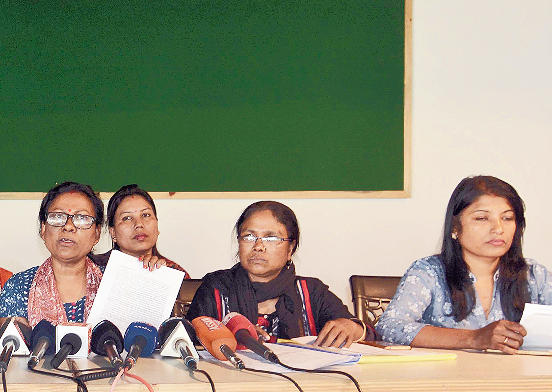 Members of the All Assam Nurses Association address the news conference in Guwahati on Friday. 