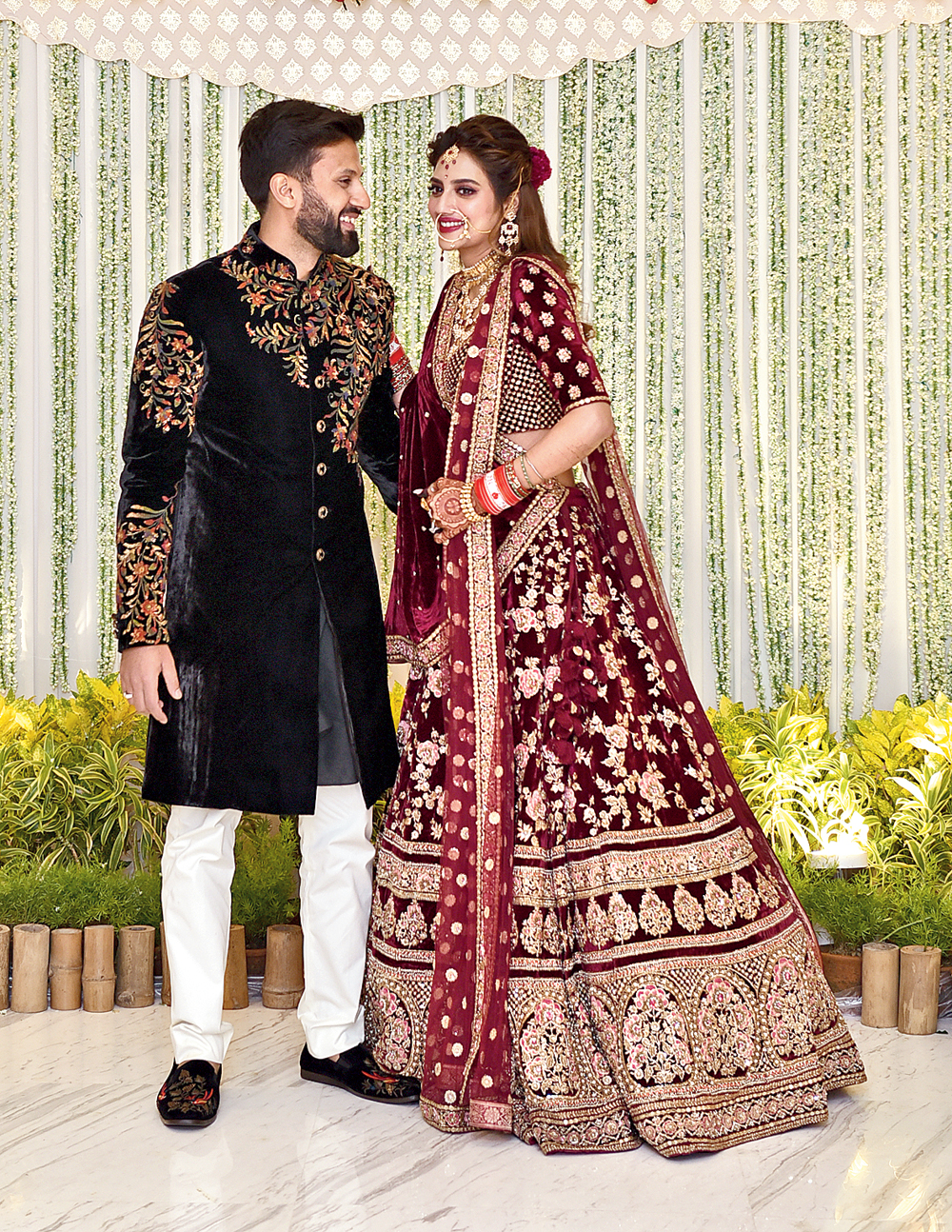 She in a wine-coloured Sabyasachi lehnga. He in a signature black Rohit Bal sherwani. Nusrat Jahan and Nikhil Jain cut a pretty picture at their reception at ITC Royal Bengal on Thursday