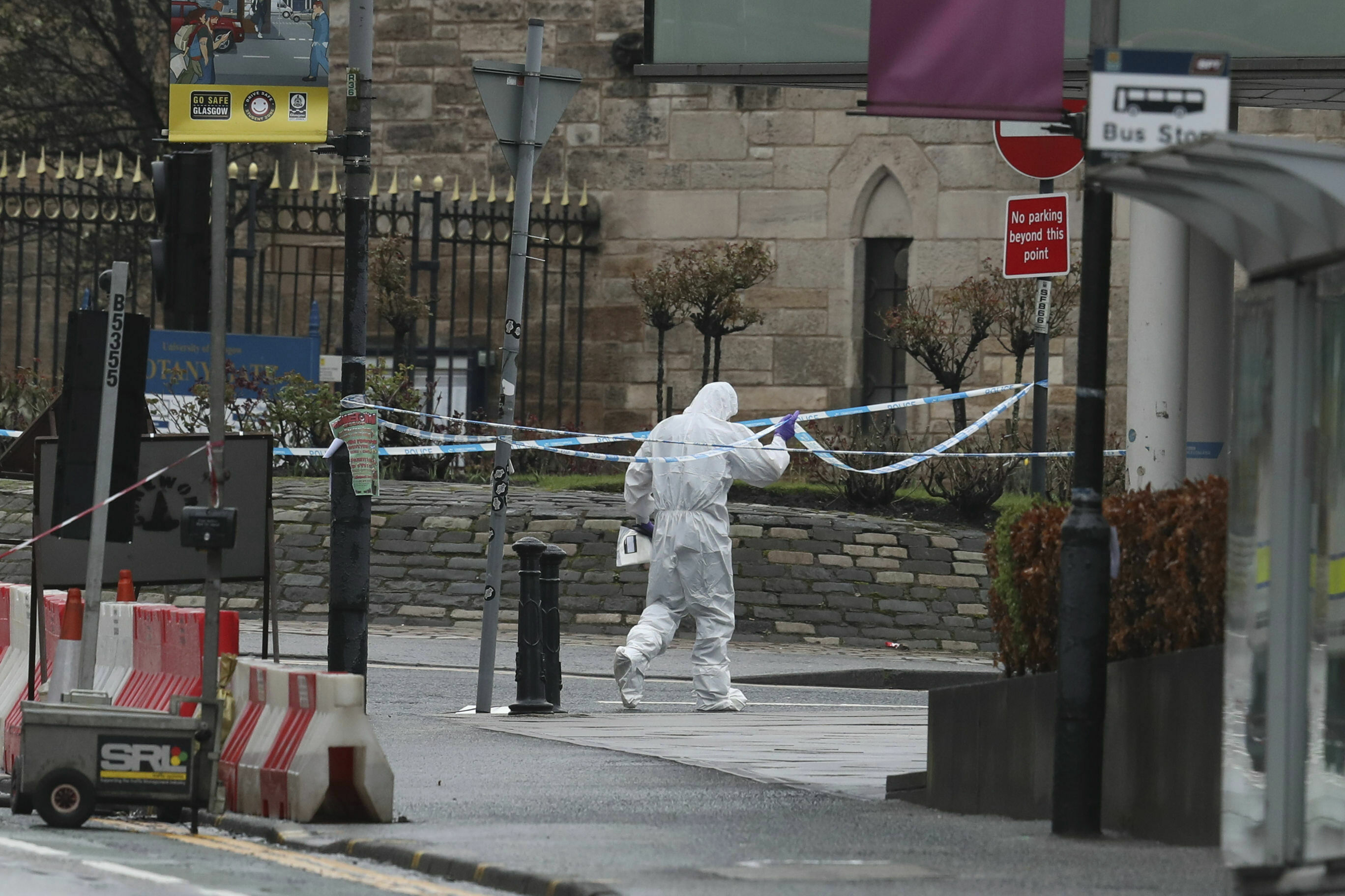 A forensic worker outside the University of Glasgow after the building was evacuated when a suspect package was found in the mailroom.