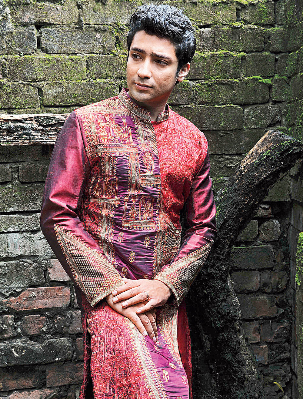 Reception ready: This “achkan designed like an angrakha” in woven, textured material is intricately embroidered with threadwork and matte zari. It can be teamed with a churidar or a beige dhuti