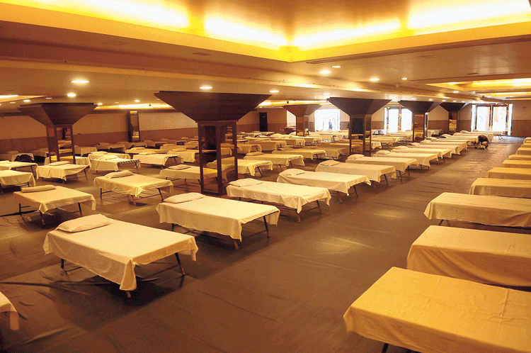 Beds lined up in a banquet hall that has been temporarily converted into an isolation ward for Covid-19 patients in New Delhi on Monday.