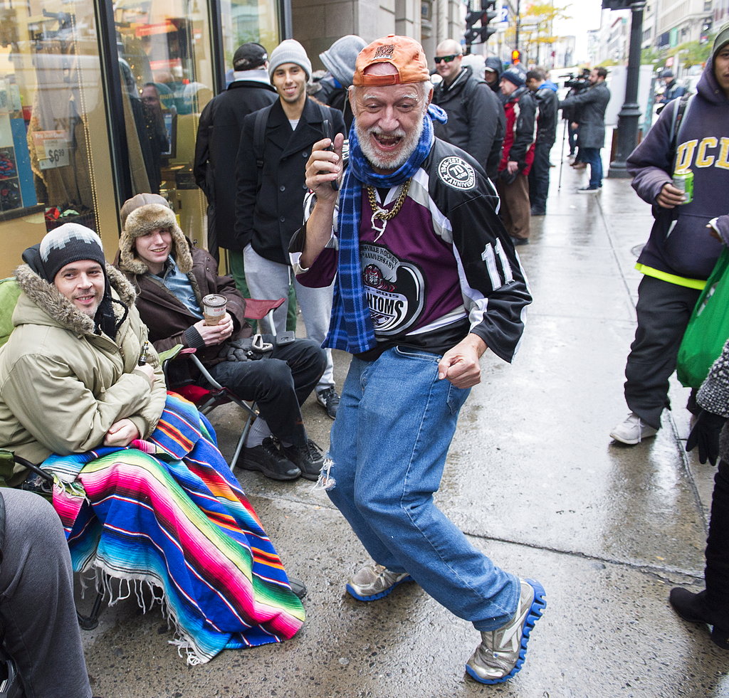 A man dances as he waits in line to purchase legal cannabis outside a government cannabis store in Montreal on Wednesday.
