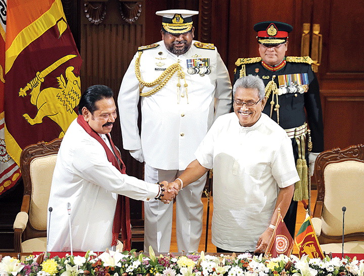 Lanka Prime Minister Mahinda Rajapaksa (left) with his younger brother President Gotabhaya Rajapaksa in Colombo on Thursday. 
