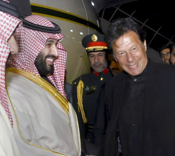 Pakistan Prime Minister Imran Khan welcomes Saudi Arabia's crown prince Mohammed bin Salman upon his arrival at the Nur Khan airbase in Rawalpindi, Pakistan, on Sunday.