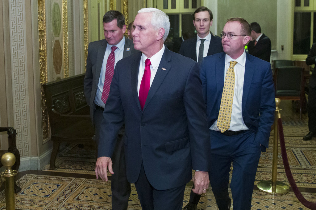 US vice-President Mike Pence (second from left) with White House senior adviser Jared Kushner, and incoming White House Chief of Staff Mick Mulvaney on Friday.