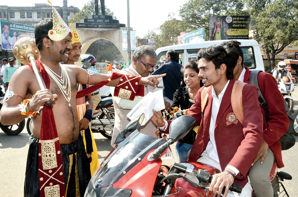 Youths dressed as Yamraj and Chitragupta warn bikers about the dangers of riding without a helmet at Randhir Verma Chowk in Dhanbad. India accounts for 5 lakh road accidents annually — the figure is among the highest in the world — in which 1.5 lakh people die and 3 lakh are crippled.