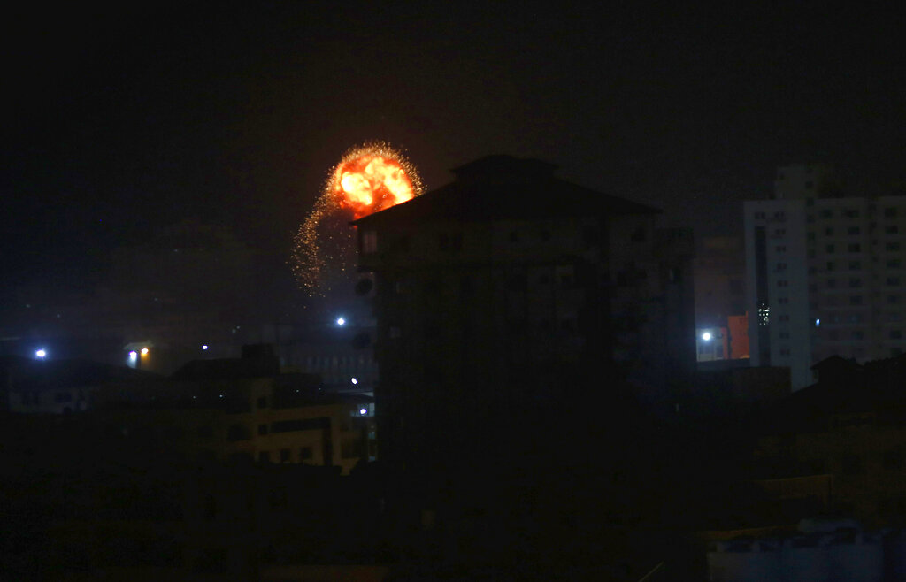 An explosion caused by Israeli airstrikes is seen on Gaza City early on Friday.