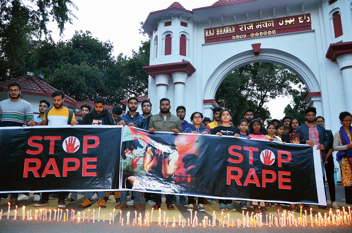 Students of National University of Study and Research in Law take part in a candle march outside Raj Bhavan in Ranchi on Saturday to protest against the rape of a law student in the capital and a veterinary doctor in Hyderabad
