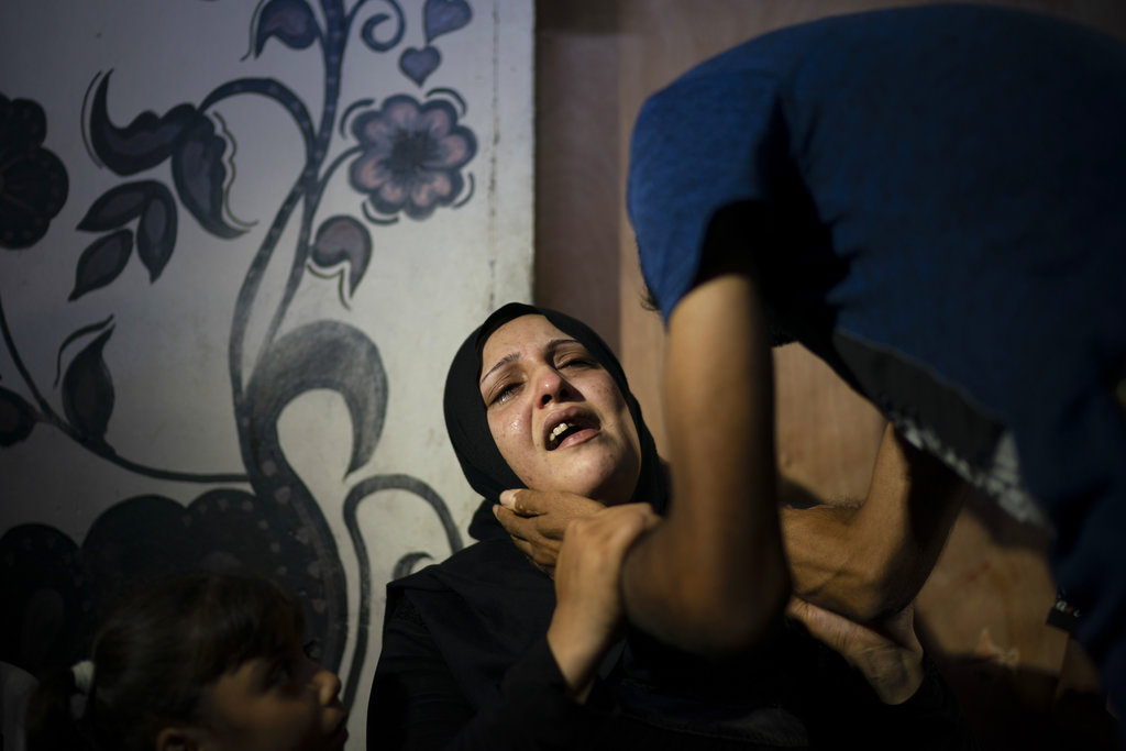 Shady Abdel-al's mother Asmaa Abdel-al at the funeral. She says she told the boy not to go, but he boarded a bus to the border organised by Hamas, whose supporters were teaching him the Quran.