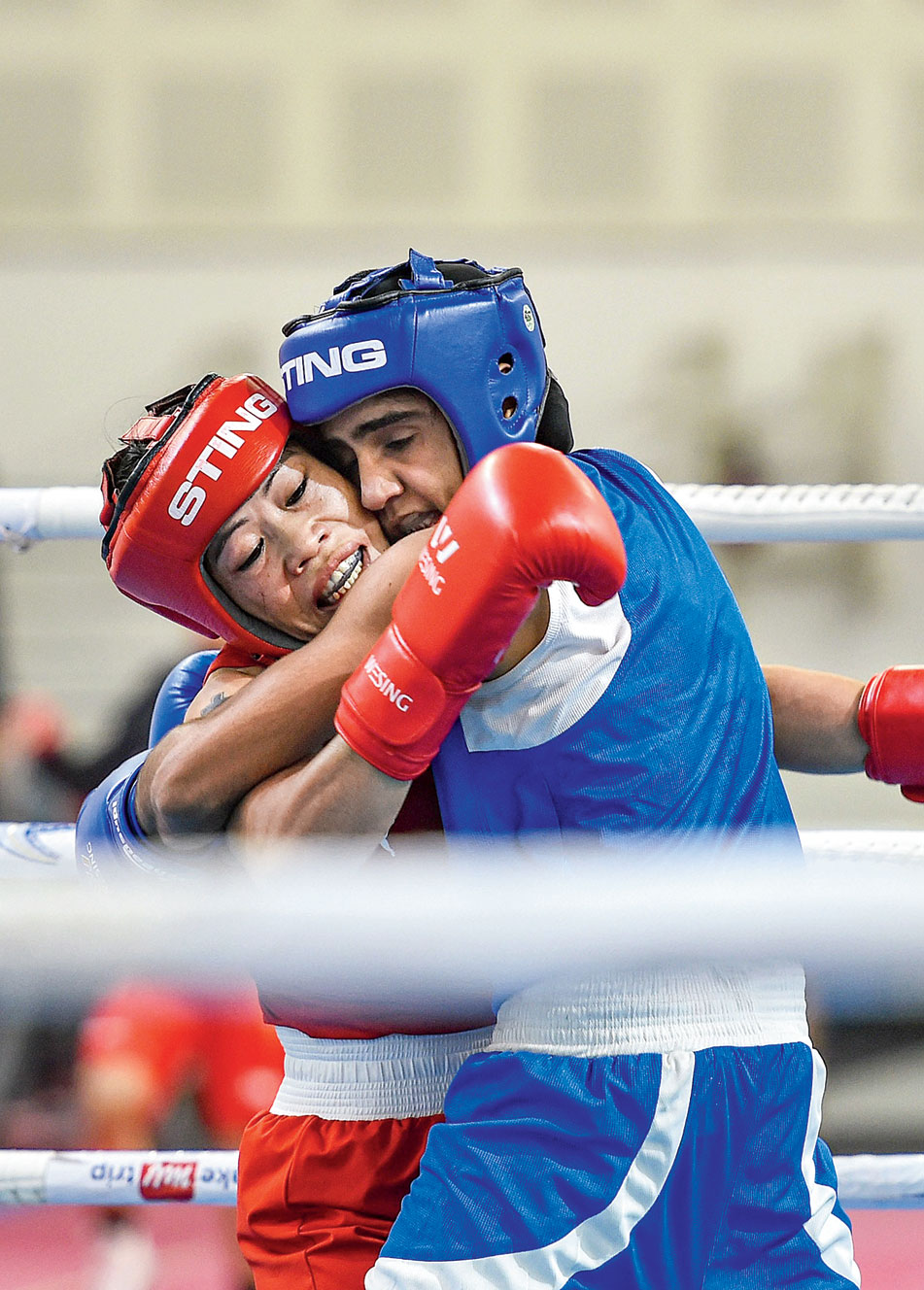 Mary Kom during her bout against Ritu Grewal during the trial for the Olympic qualifiers in New Delhi on Friday
