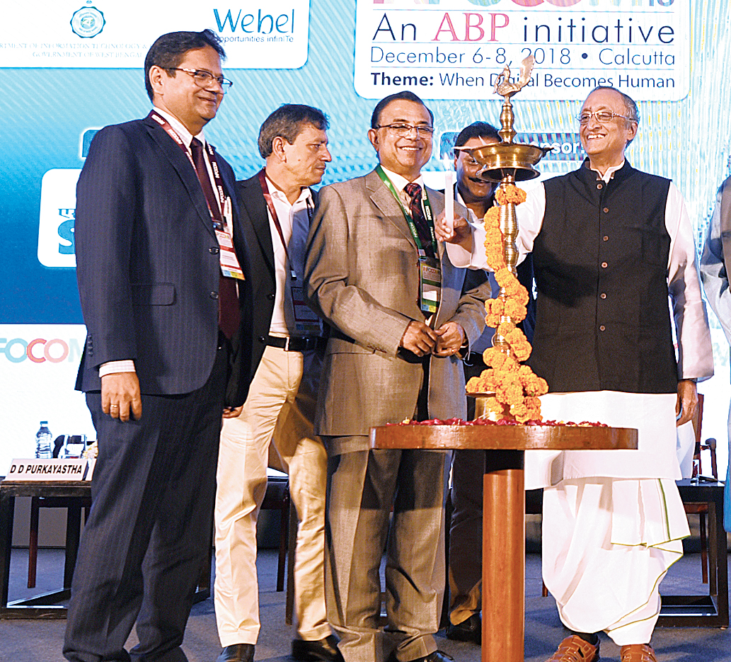 Bengal IT minister Amit Mitra lights the inaugural lamp at Infocom 2018 as D.D. Purkayastha (third from right), MD & CEO of ABP Pvt Ltd, and others look on in Calcutta on Thursday.
