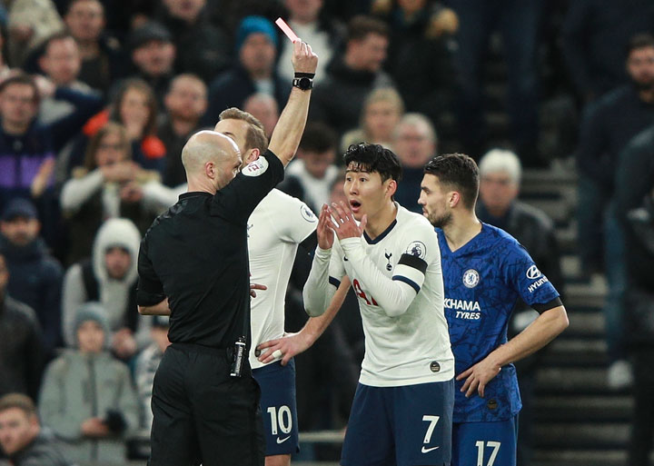 Referee Anthony Taylor shows a red card to Tottenham's Son Heung-min during the English Premier League Football match between Tottenham Hotspur and Chelsea