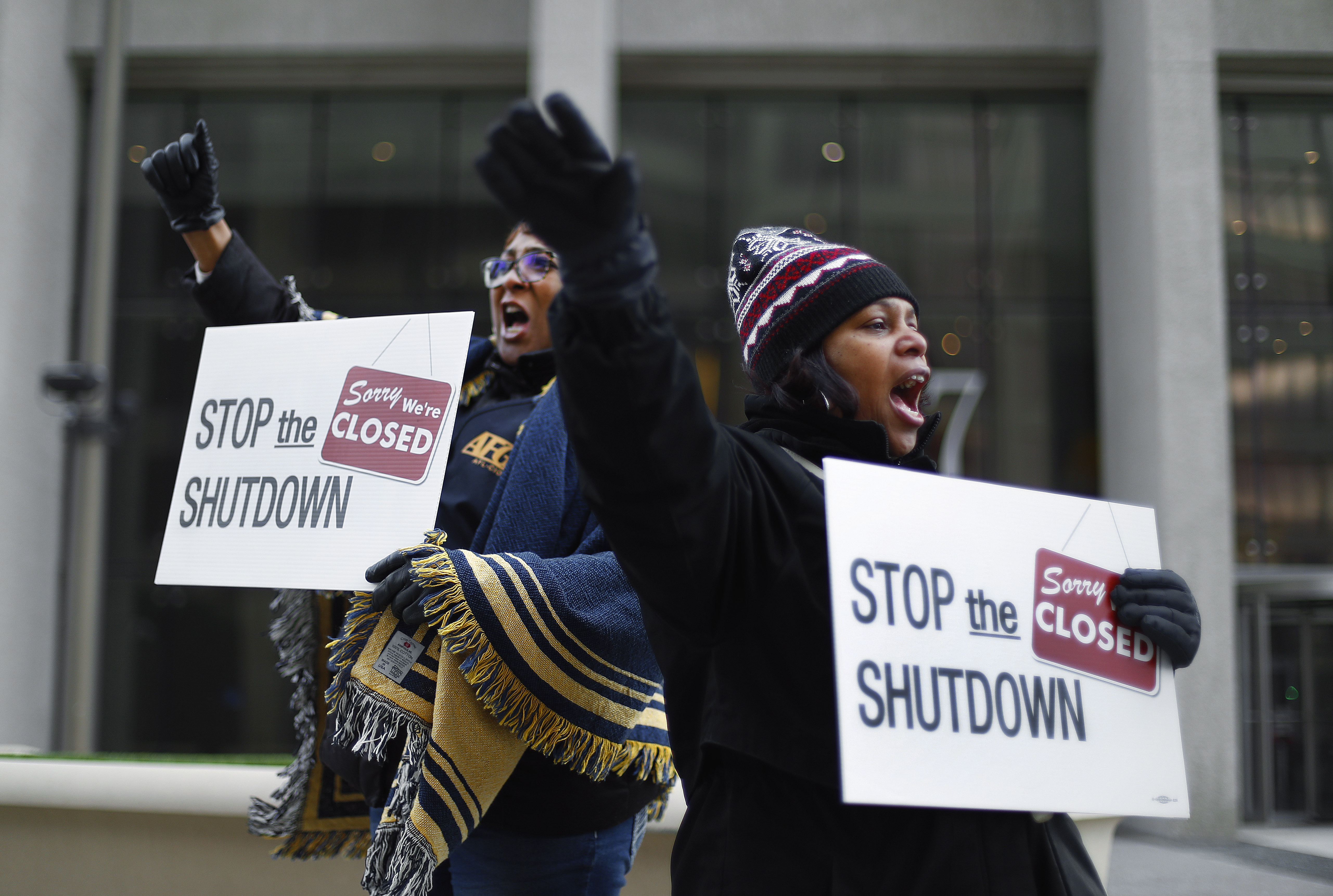 In this January 10, 2019 file photo, Cheryl Monroe, right, a US Food and Drug Administration employee, and Bertrice Sanders, a Social Security Administration employee, rally to call for an end to the partial US government shutdown in Detroit