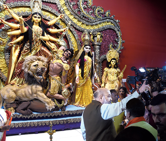 Union home minister Amit Shah at the BJ Block Puja in Salt Lake on Tuesday. Shah opened the puja and in a speech before the inauguration, urged the people to vote the BJP to power in Bengal in 2021. Chants of “Jai Shri Ram” were heard during the inauguration of the Durga idol at the puja, whose organising committee president is a BJP state committee member.