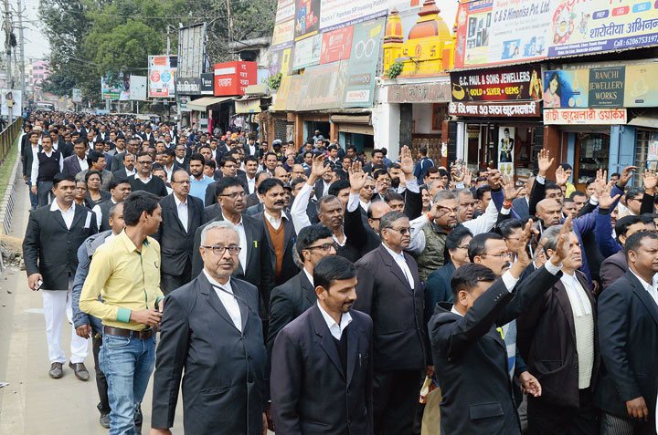 Lawyers take part in a silent march towards Albert Ekka Chowk in Ranchi on Tuesday to protest the murder of their colleague on Monday night. 