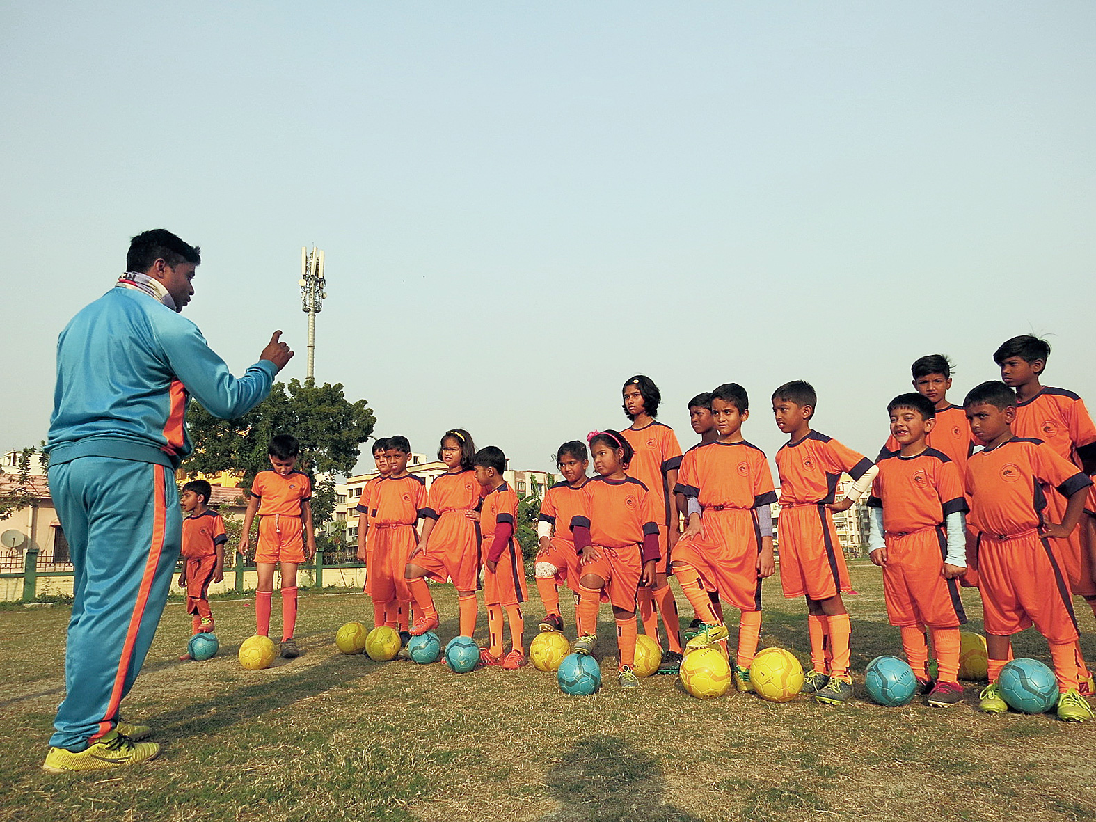 Boys and girls all ears as the coach speaks.