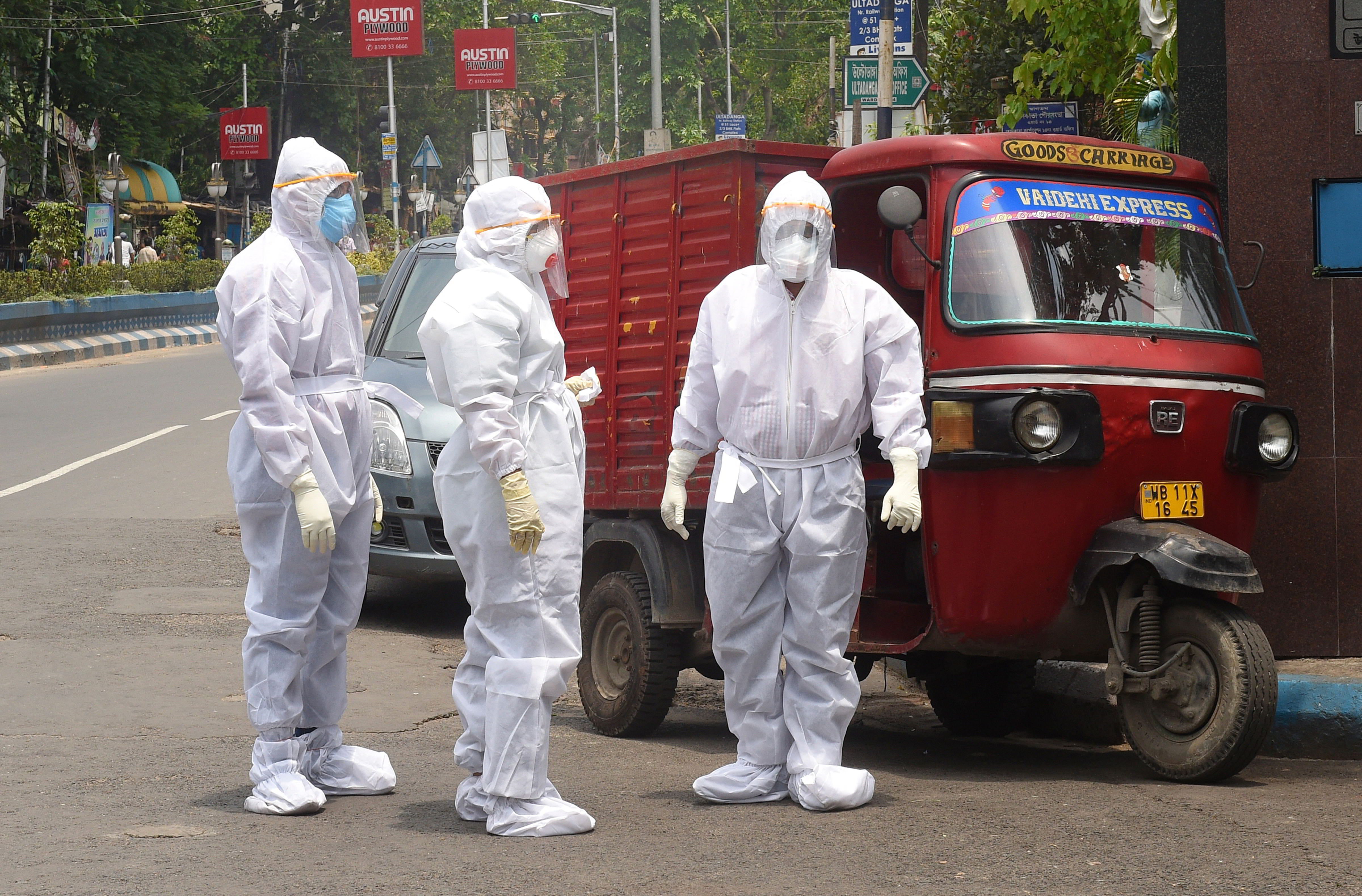 Medics stand on a street to collect swab samples for COVID-19 test, during the ongoing nationwide Covid-19 lockdown, in Calcutta, Thursday, May 07, 2020.