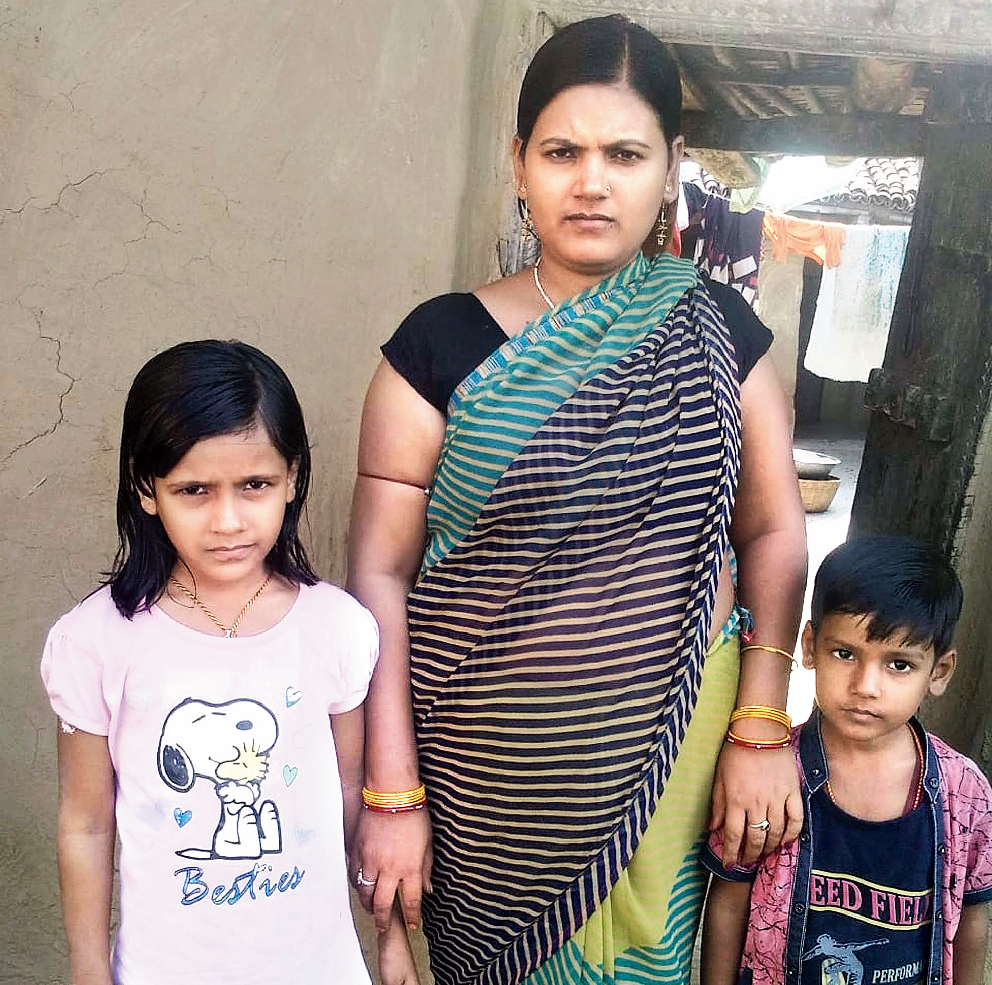 Soni Kumari with her kids at Pratapur in Chatra. 

