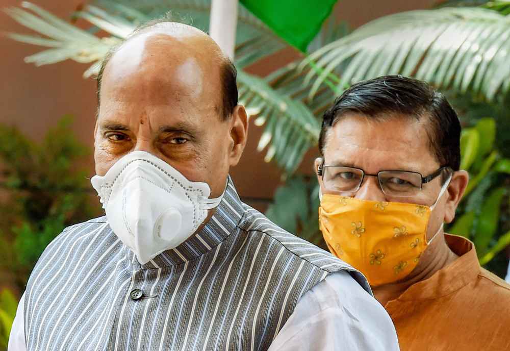 Union Defence Minister and senior BJP leader Rajnath Singh with BJP National Vice President Shyam Jaju arrive to address the Uttrakhand Jan-Samvad virtual rally, from BJP HQ in New Delhi, Monday, June 15, 2020.