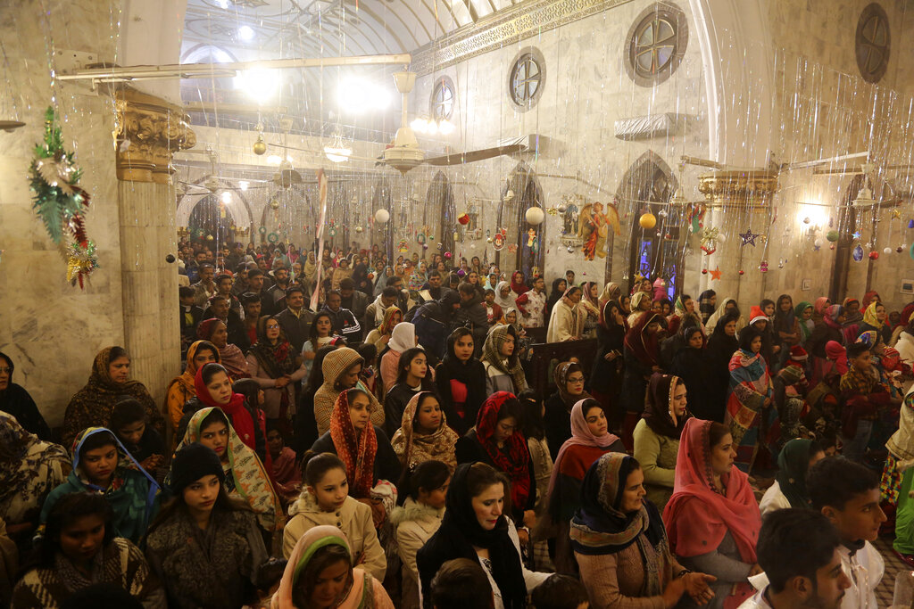 Pakistani Christians attend midnight services at St. Anthony's Church to celebrate Christmas in Lahore, Pakistan, Tuesday, Dec. 24, 2019.
