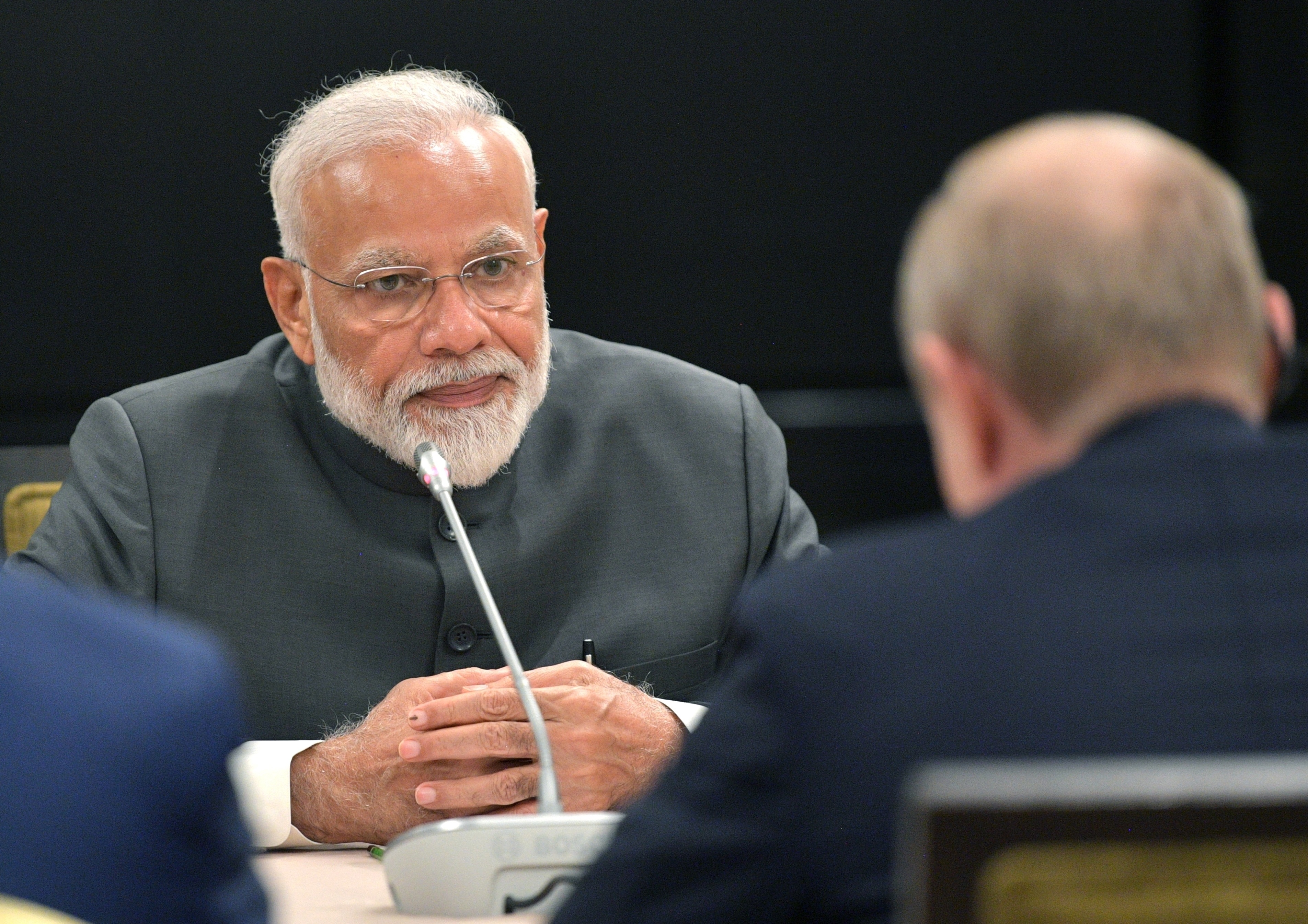Narendra Modi listens to Russian President Vladimir Putin (back to a camera) during their talks on a sidelines of the Shanghai Cooperation Organization Summit in Bishkek, Kyrgyzstan, on June 13.