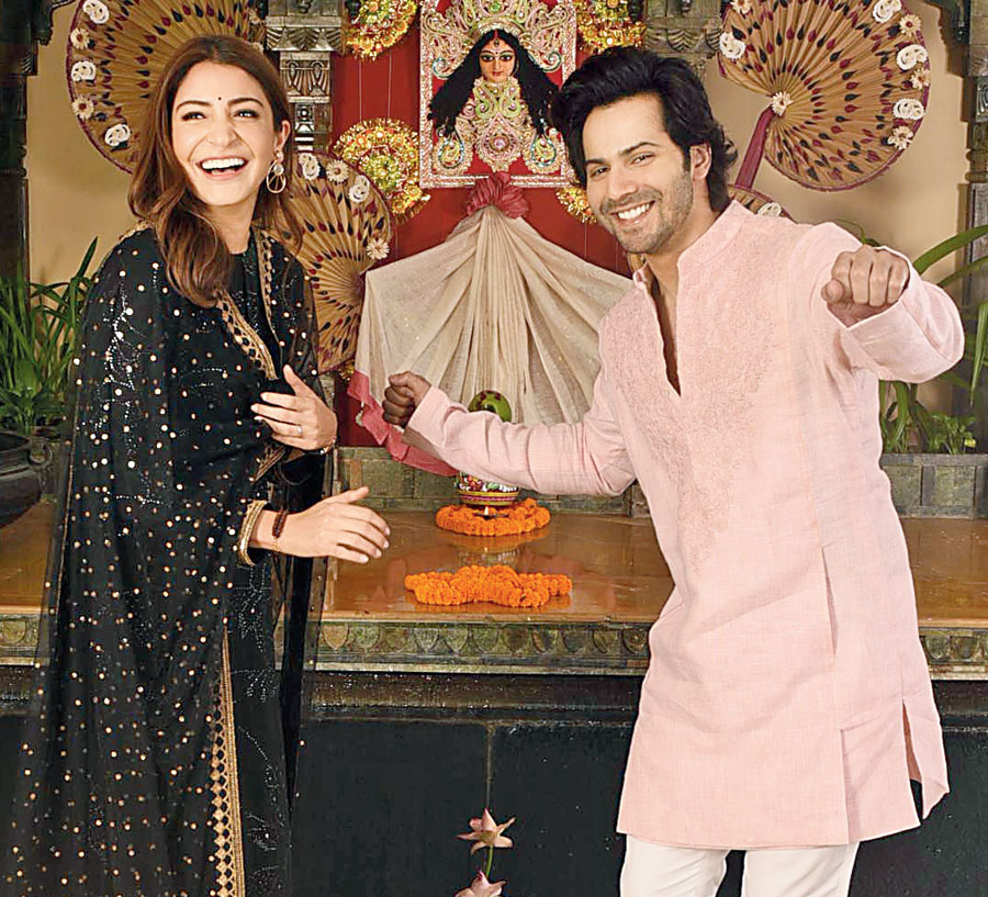 Anushka cheers Varun on.