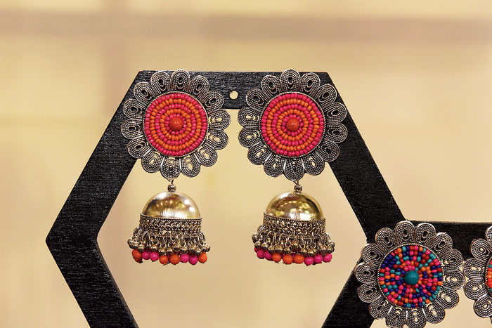 This pair of traditional German silver jhumkas with colourful beads can glam up any solid kurta or sari. 
Rs 1,500 @Pooja Gandhi
(find her on Instagram @poojagandhiofficial)