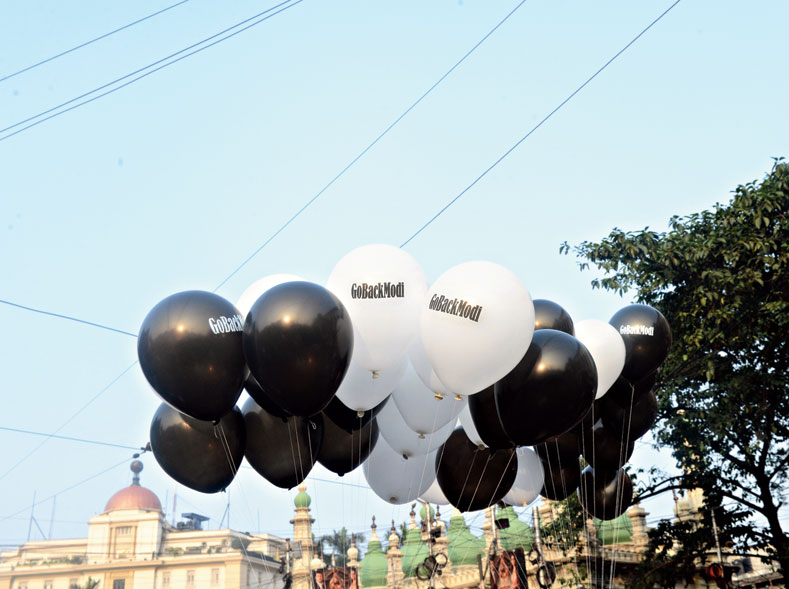Balloons with “Go Back Modi” written on them at Esplanade