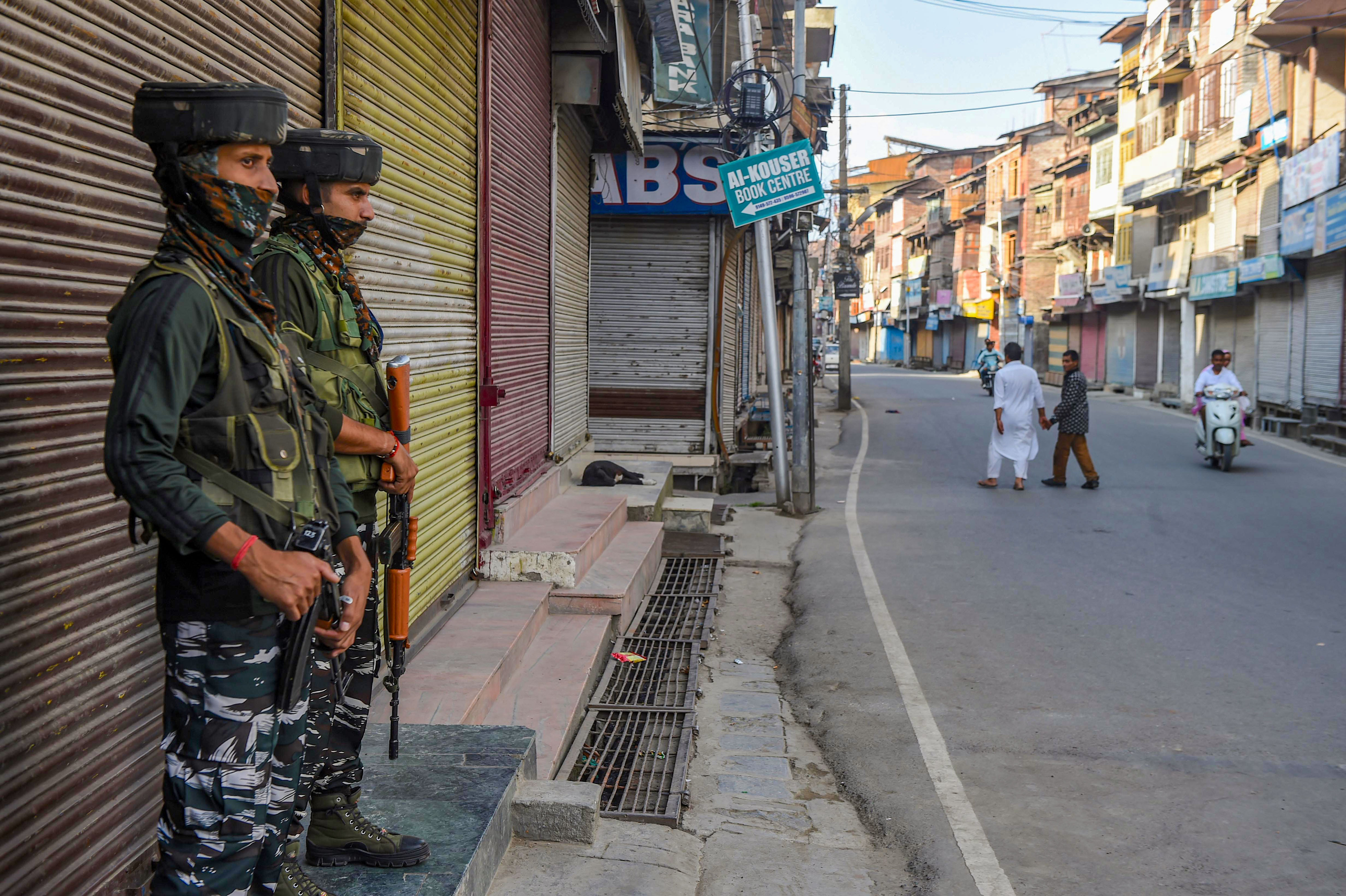 Security personnel stand guard in Srinagar on September 7.