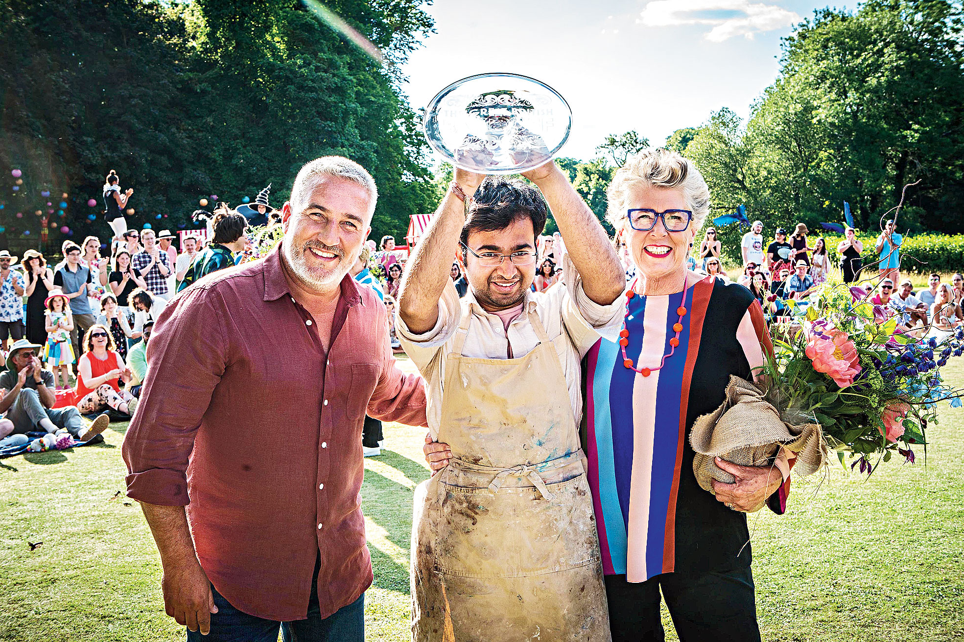 Rahul Mandal flanked by The Great British Bake Off judges Paul Hollywood (left) and Prue Leith 