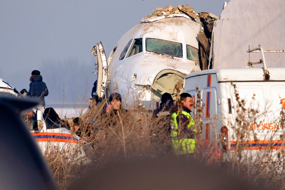 Rescuers on the site of a plane crash near Almaty International Airport on December 27