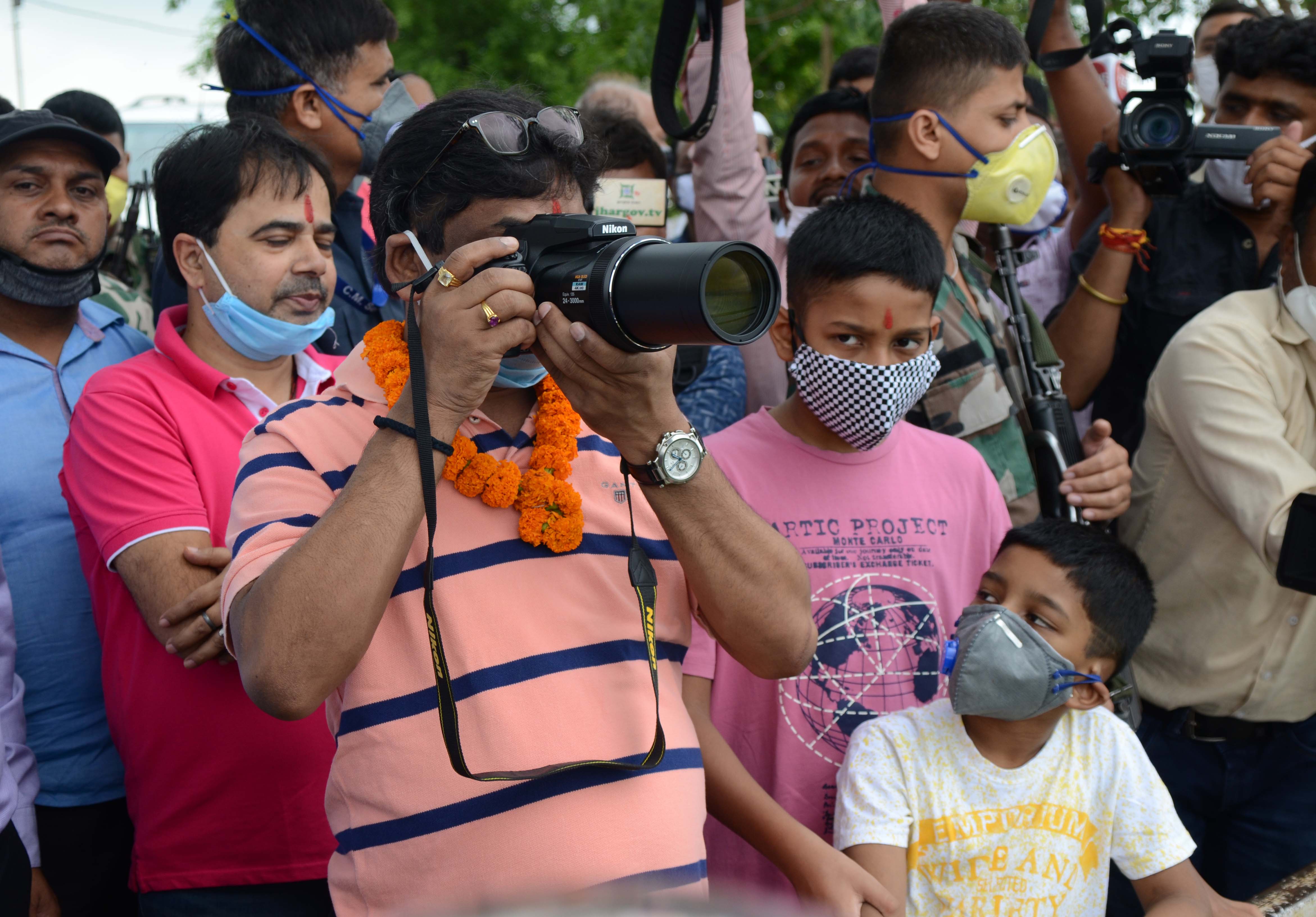 Chief minister Hemant Soren taking pictures of the view from Ranchi hill (following picture)