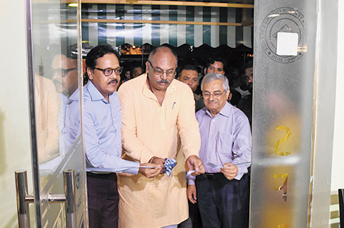 Minister Chandranath Sinha inaugurates the restaurant on Wednesday. SFDC managing director Subrata Mukherjee is to his right.