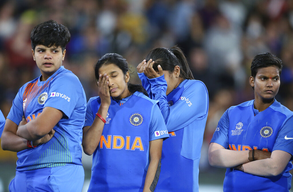 Indian players gather together after their loss to Australia in the Women's T20 World Cup cricket final match in Melbourne on Sunday