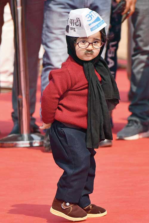 ‘KGwall’: A child dressed as Delhi chief minister Arvind Kejriwal during his swearing-in at the Ramlila Maidan in New Delhi on Sunday.