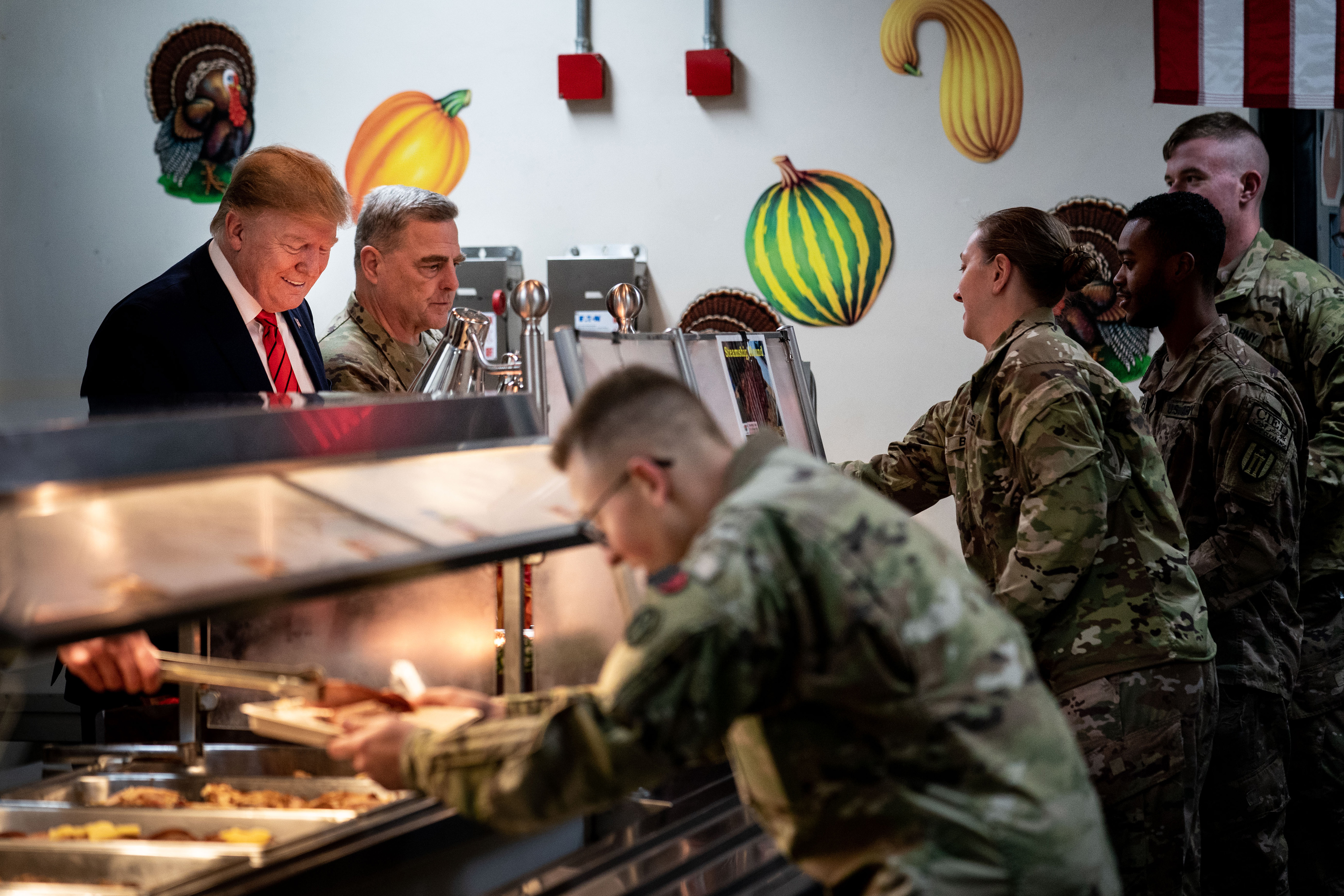 US President Donald Trump serves food to troops during a Thanksgiving visit to Bagram Air Field in Bagram district, Afghanistan on Thursday, November 28, 2019.