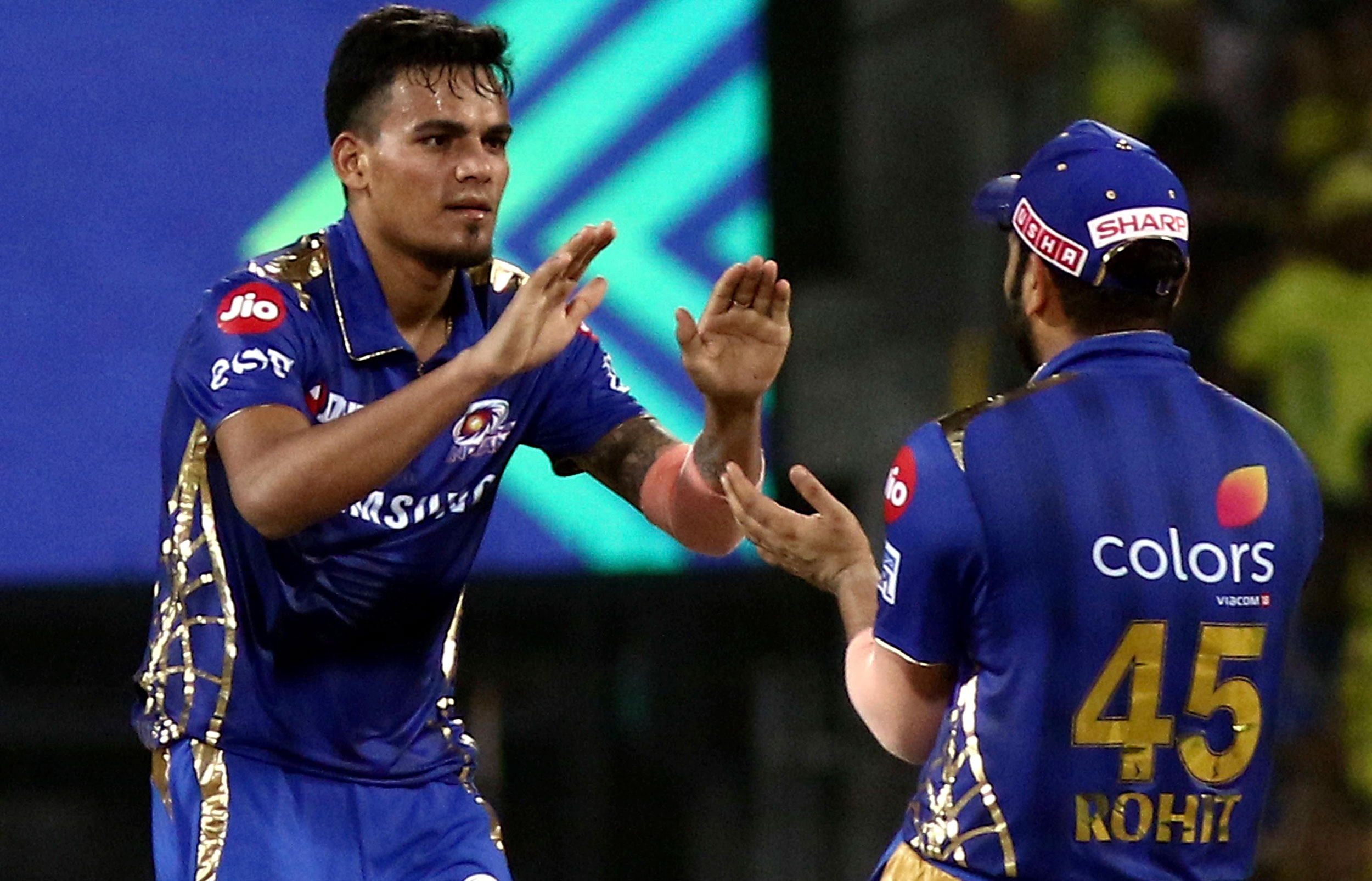 Rahul Chahar and Rohit Sharma of Mumbai Indians celebrate after taking Murali Vijay's wicket during the qualifier match of IPL in Chennai, on May 7, 2019. 