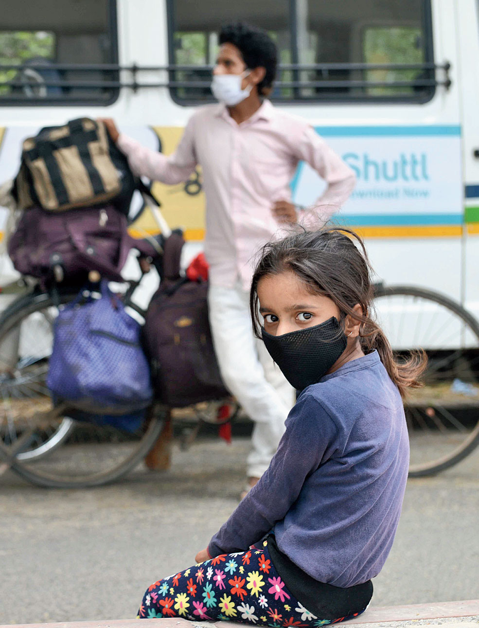 A girl takes a break in Noida on Tuesday.