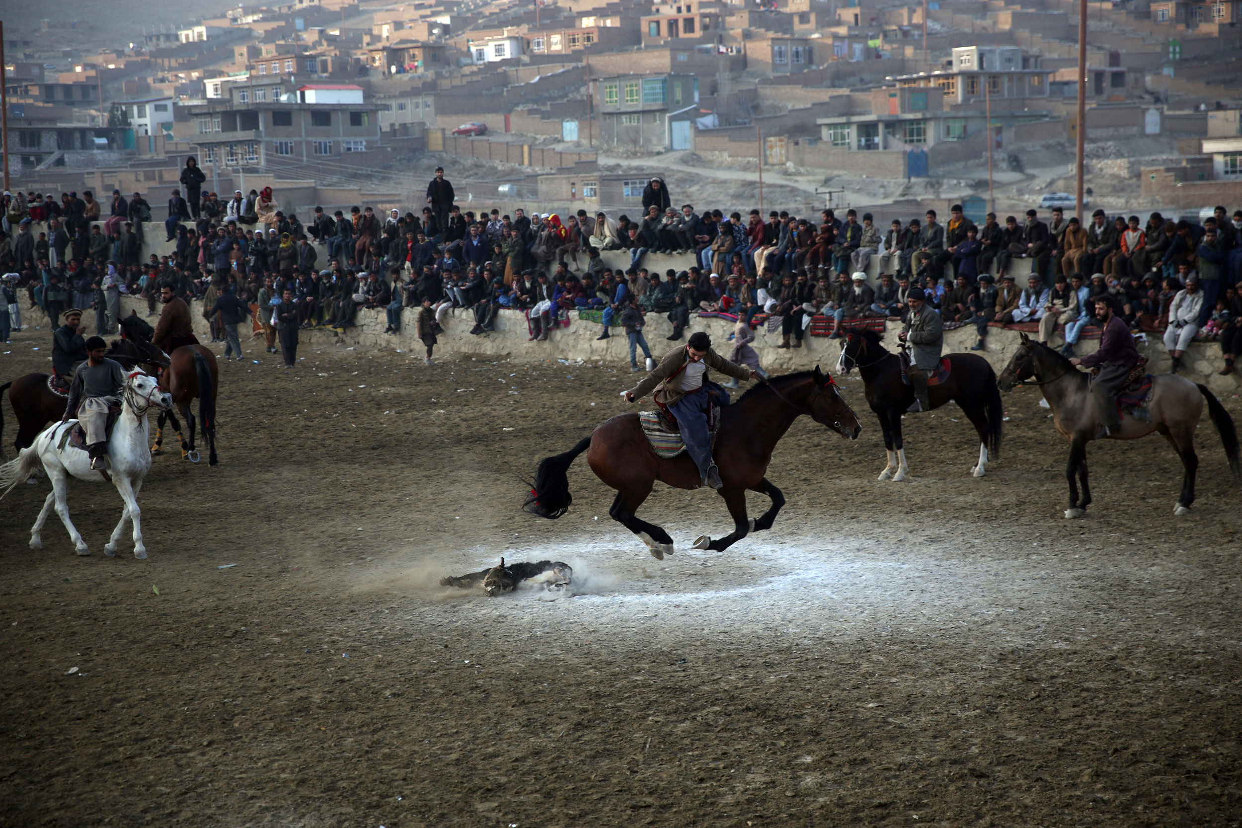 Horse riders compete for the goat during a friendly buzkashi match on the outskirts of Kabul, Afghanistan, on Friday. 