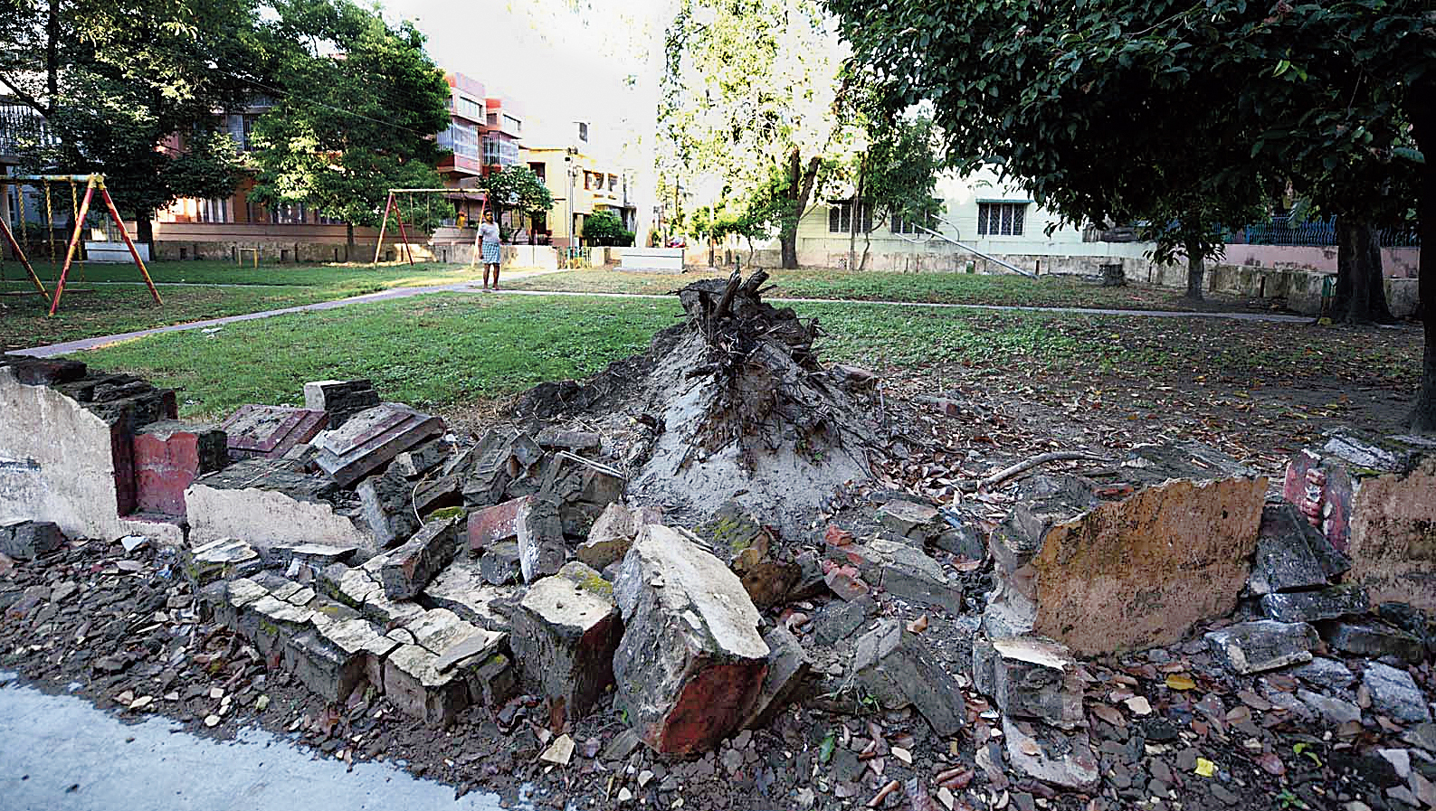 HA Block: The stump of a tree that had fallen during a thundershower last year has not yet been removed. A trident lamp post in the compound (not in the picture) tilts dangerously with wires sticking out of it. The see-saw and the swing are unusable because of lack of maintenance. Residents said the lights in the park did not work.
