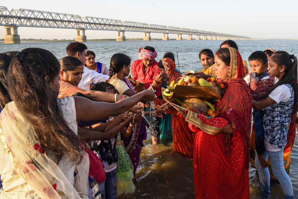 Devotees during the Chaiti Chhath Puja in Patna on Monday