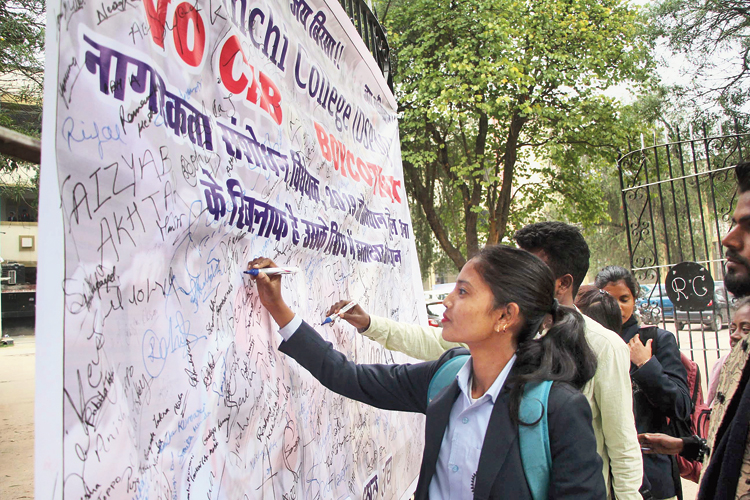 Shyama Prasad Mukherjee University students at the signature campaign against Citizenship (Amendment) Act  and National Register of Citizens organised by the students’ union at the university main gate in Ranchi on Tuesday.
