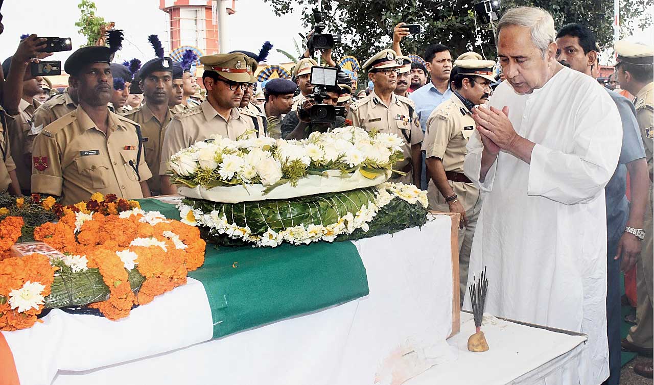 Odisha chief minister Naveen Patnaik pays homage to the slain jawans in Bhubaneswar. 