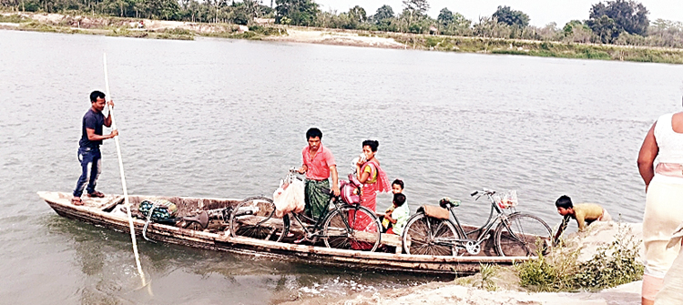 Villagers board a boat to cross the Nadihing 