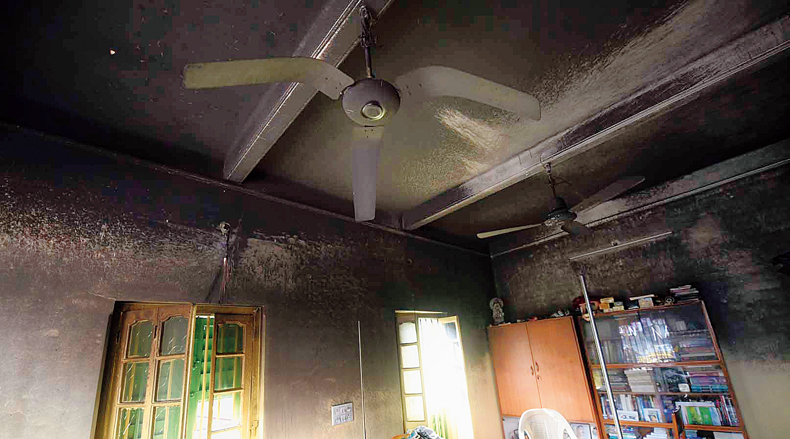 A ceiling fan in Rathin Samajpati’s flat bent out of shape because of the fire .